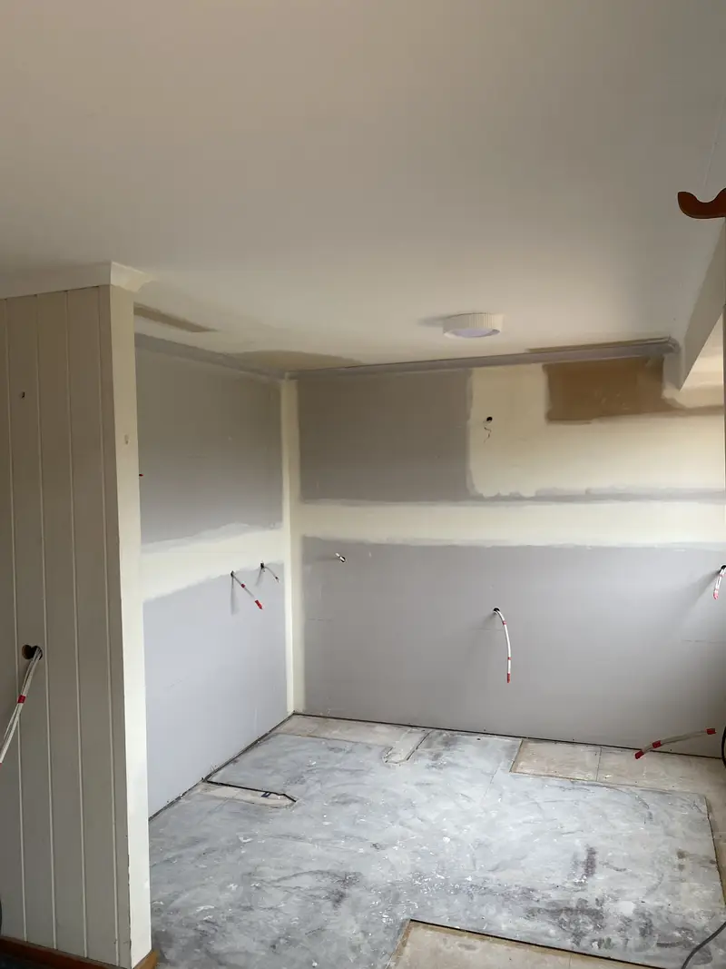 Renovation plastering in progress on walls and ceiling of Seymour home